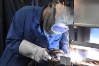 welder works in metal construction - construction and processing