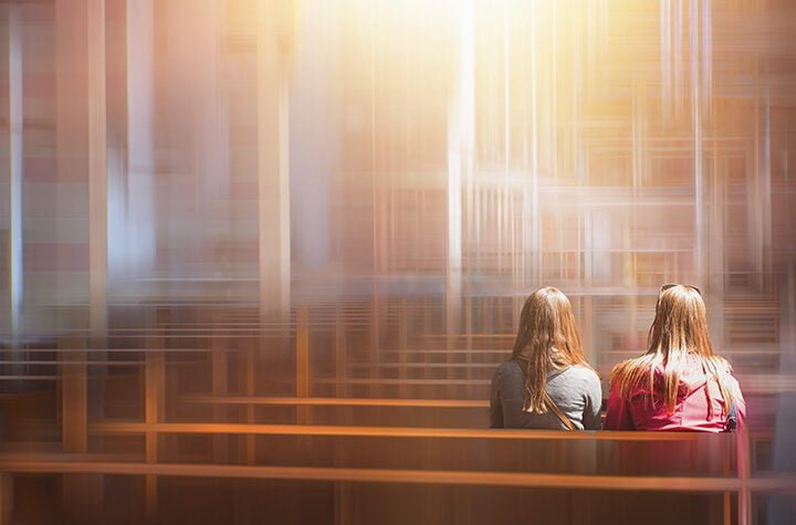 People praying in a church  - Blurred photo inside of a church