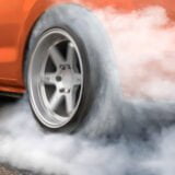 Race drift car burning tires on playground