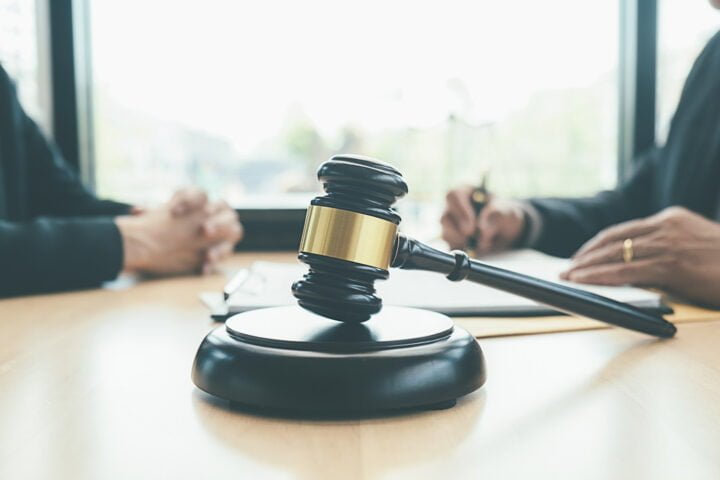 Judge gavel with Justice lawyers having team meeting at law firm