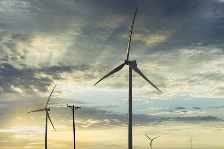 Wind turbines windmill energy farm the beautiful sunset in Texas