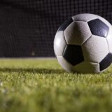 Close-up of soccer ball on playing field