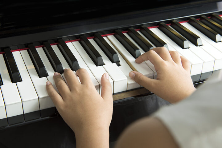 Little girl playing piano