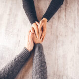 woman and man hand in hand