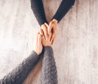 woman and man hand in hand