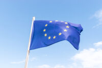 European Union flag on blue sky background