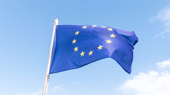 European Union flag on blue sky background