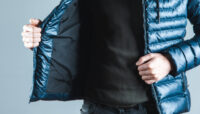 man hand  jacket on gray background